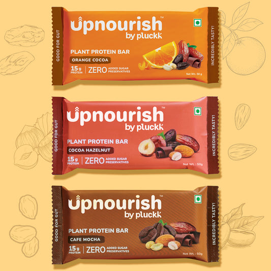 Three Upnourish plant protein bars on a yellow background with illustrations of fruits and nuts.